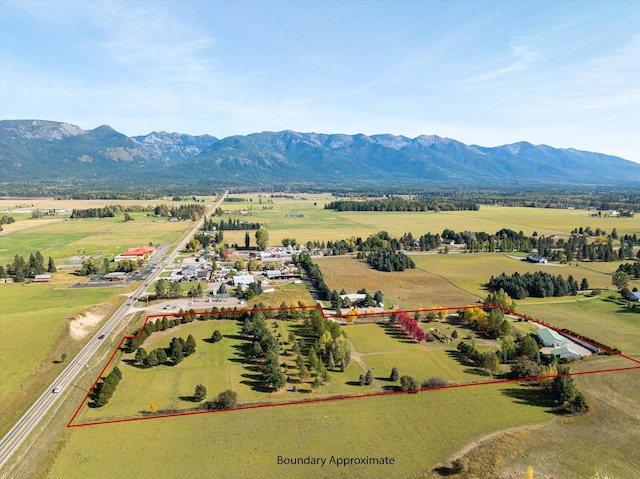 140 Swan River Rd, Bigfork, MT 59911 - aerial view of sparsely populated area with property parcel outlined and a mountain backdrop