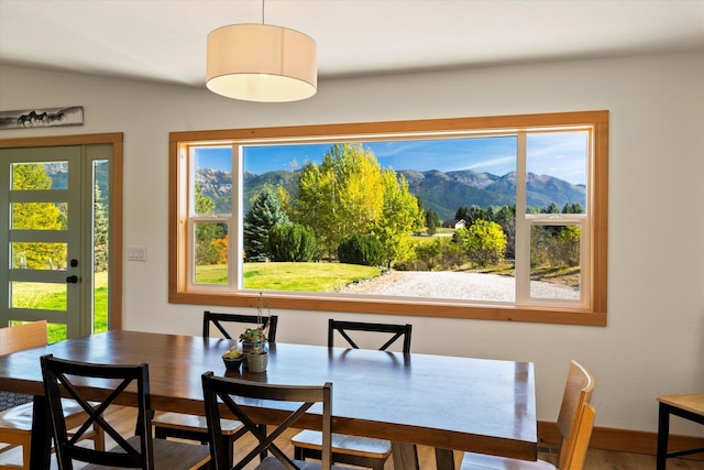 140 Swan River Rd, Bigfork, MT 59911 - dining room featuring a mountain view and baseboards