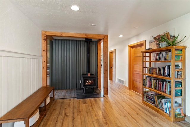 140 Swan River Rd, Bigfork, MT 59911 - hall with light wood-type flooring, recessed lighting, and wainscoting
