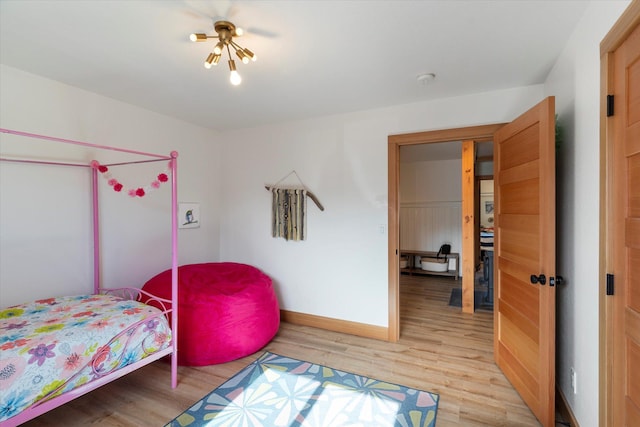140 Swan River Rd, Bigfork, MT 59911 - bedroom with light wood-style flooring and baseboards