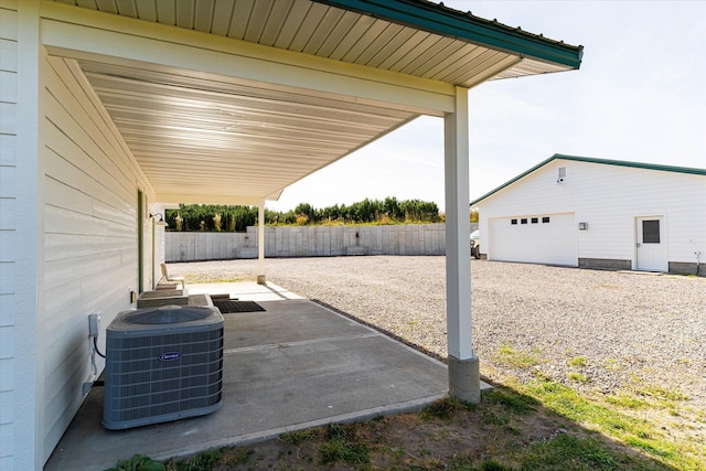 140 Swan River Rd, Bigfork, MT 59911 - fenced backyard featuring an outbuilding and a patio