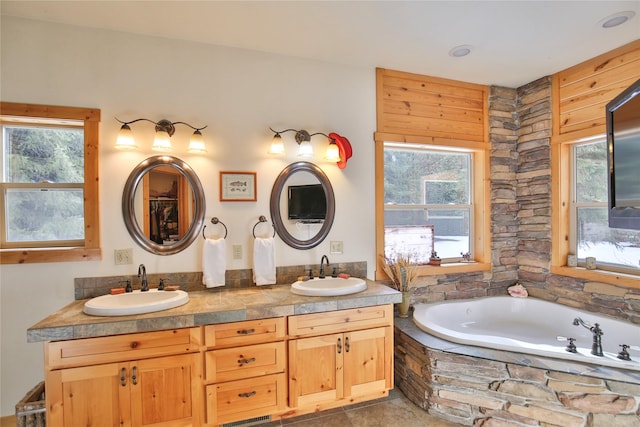 133 Klakken Rd, Noxon, MT 59853 - bathroom with a bath, a wealth of natural light, and a sink