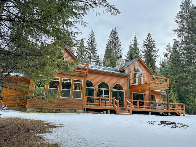 133 Klakken Rd, Noxon, MT 59853 - snow covered property with a chimney, a wooden deck, crawl space, and a balcony
