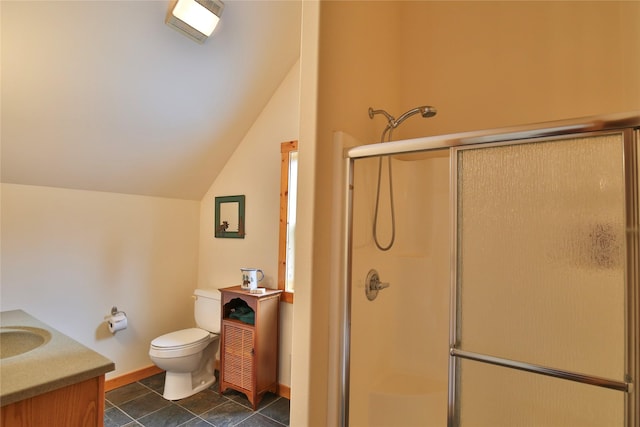 133 Klakken Rd, Noxon, MT 59853 - full bath featuring toilet, a stall shower, vaulted ceiling, baseboards, and vanity