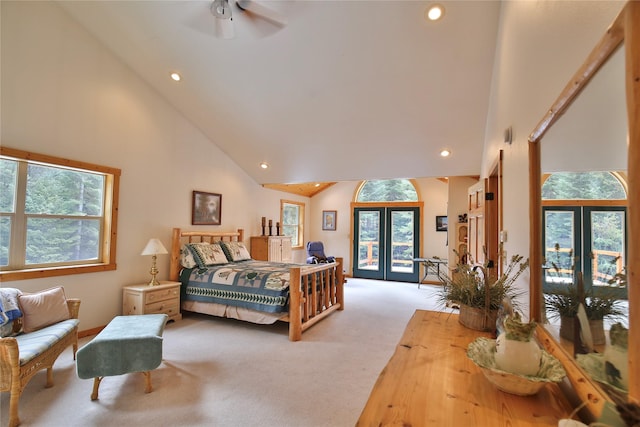 133 Klakken Rd, Noxon, MT 59853 - bedroom featuring french doors, carpet flooring, access to exterior, multiple windows, and high vaulted ceiling