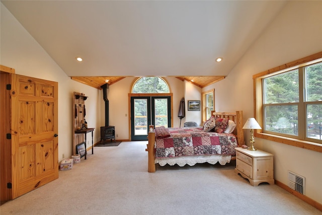 133 Klakken Rd, Noxon, MT 59853 - carpeted bedroom featuring recessed lighting, a wood stove, access to outside, and visible vents