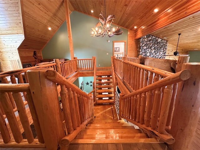 133 Klakken Rd, Noxon, MT 59853 - stairs featuring vaulted ceiling, hardwood / wood-style floors, and wooden ceiling