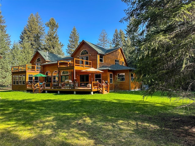 133 Klakken Rd, Noxon, MT 59853 - back of property with a wooden deck and a yard