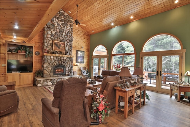 133 Klakken Rd, Noxon, MT 59853 - living area with high vaulted ceiling, wooden ceiling, french doors, a fireplace, and hardwood / wood-style flooring
