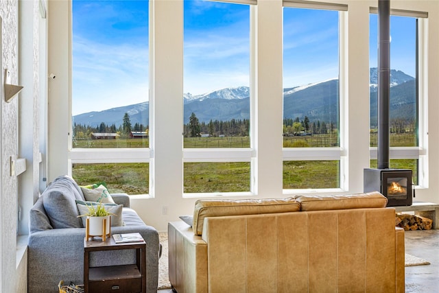5052 Hoblitt Ln N, Florence, MT 59833 - living room with a mountain view, healthy amount of natural light, and a wood stove