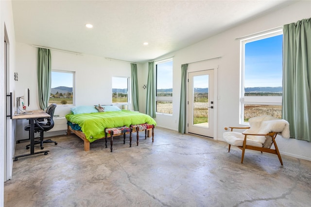 5052 Hoblitt Ln N, Florence, MT 59833 - bedroom featuring concrete floors, access to exterior, and recessed lighting
