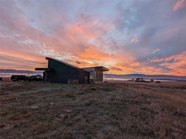 5052 Hoblitt Ln N, Florence, MT 59833 - view of side of property featuring a mountain view and an outbuilding