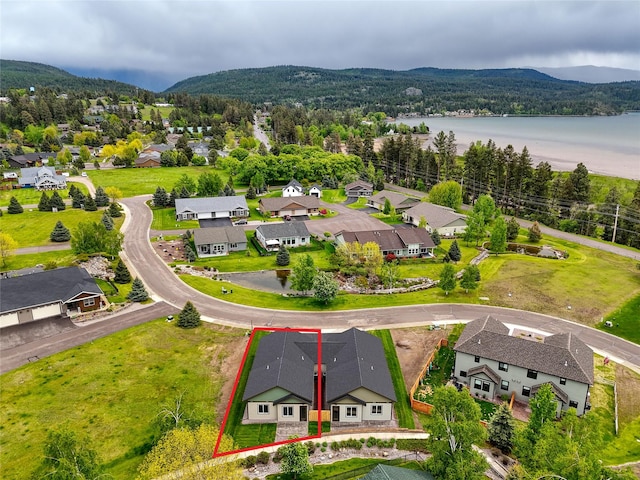 1048 Mill Creek Dr, Bigfork, MT 59911 - aerial perspective of suburban area featuring property boundaries highlighted and a water and mountain view