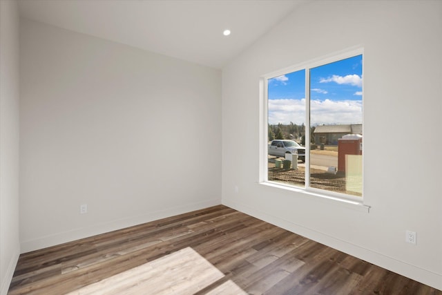 1048 Mill Creek Dr, Bigfork, MT 59911 - spare room with vaulted ceiling, wood finished floors, recessed lighting, and baseboards