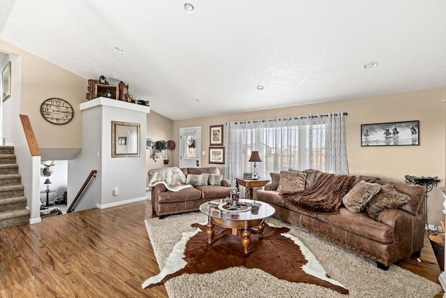 living area featuring recessed lighting, baseboards, wood finished floors, and stairs
