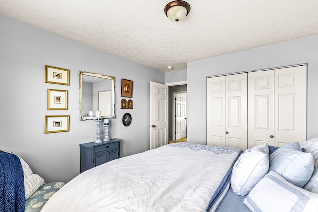 bedroom featuring a closet and a textured ceiling