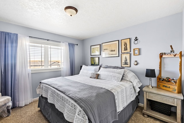 carpeted bedroom featuring a textured ceiling and baseboards
