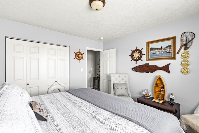 bedroom with a closet and a textured ceiling