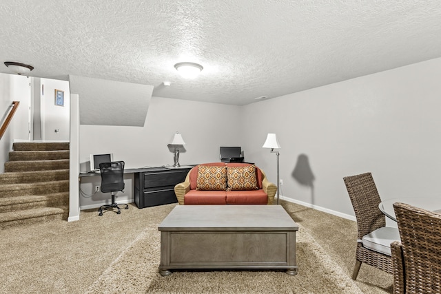 home office with baseboards, light colored carpet, and a textured ceiling