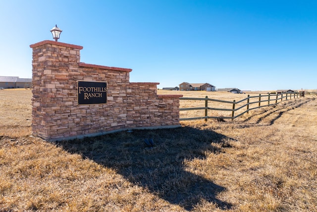 community sign with fence