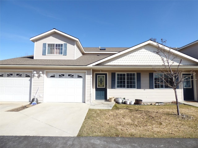 103 Alice Ave Unit B, Hamilton, MT 59840 - view of front facade featuring concrete driveway, an attached garage, and a front yard