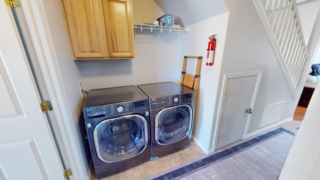 103 Alice Ave Unit B, Hamilton, MT 59840 - washroom with cabinet space and washer and clothes dryer