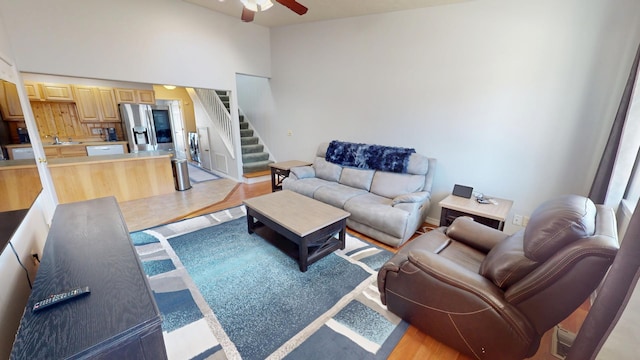 103 Alice Ave Unit B, Hamilton, MT 59840 - living area with ceiling fan, stairs, light wood-type flooring, and vaulted ceiling