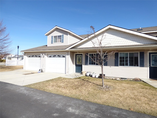103 Alice Ave Unit B, Hamilton, MT 59840 - view of front facade featuring concrete driveway, a front yard, an attached garage, and a shingled roof