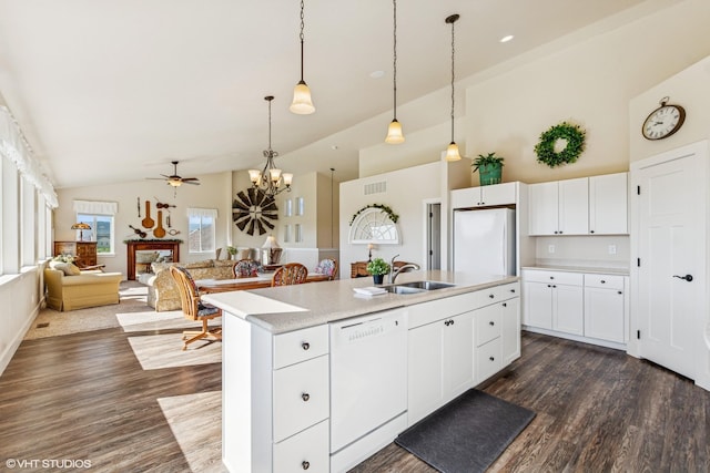 113 Mountain Vista Ct, Kalispell, MT 59901 - kitchen featuring white appliances, dark wood-style flooring, light countertops, pendant lighting, and high vaulted ceiling