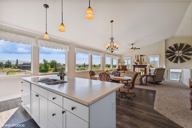 113 Mountain Vista Ct, Kalispell, MT 59901 - kitchen featuring a sink, white dishwasher, open floor plan, a chandelier, and pendant lighting