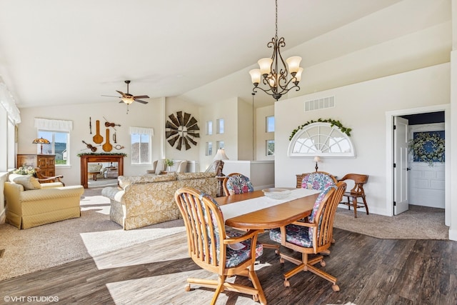 113 Mountain Vista Ct, Kalispell, MT 59901 - dining room with a chandelier, dark wood-type flooring, vaulted ceiling, baseboards, and ceiling fan