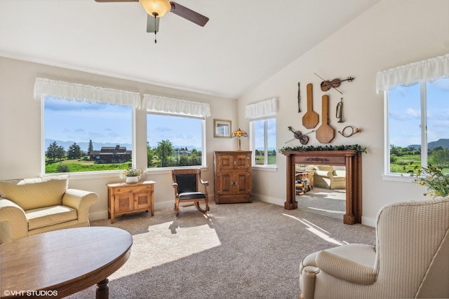 113 Mountain Vista Ct, Kalispell, MT 59901 - carpeted living room with lofted ceiling, a ceiling fan, and baseboards