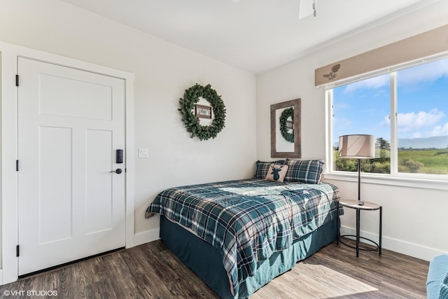 113 Mountain Vista Ct, Kalispell, MT 59901 - bedroom featuring baseboards and dark wood-style flooring