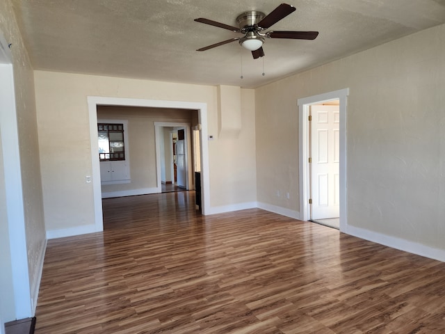 406 W 1st St W, Whitehall, MT 59759 - unfurnished room featuring dark wood finished floors, ceiling fan, and a textured ceiling