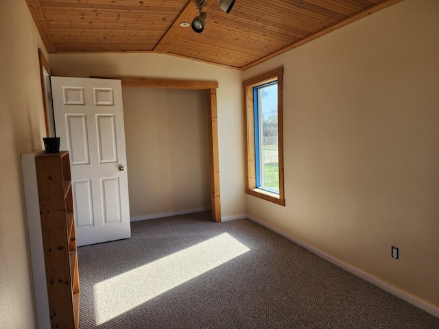 406 W 1st St W, Whitehall, MT 59759 - unfurnished bedroom featuring wooden ceiling, baseboards, lofted ceiling, and carpet floors