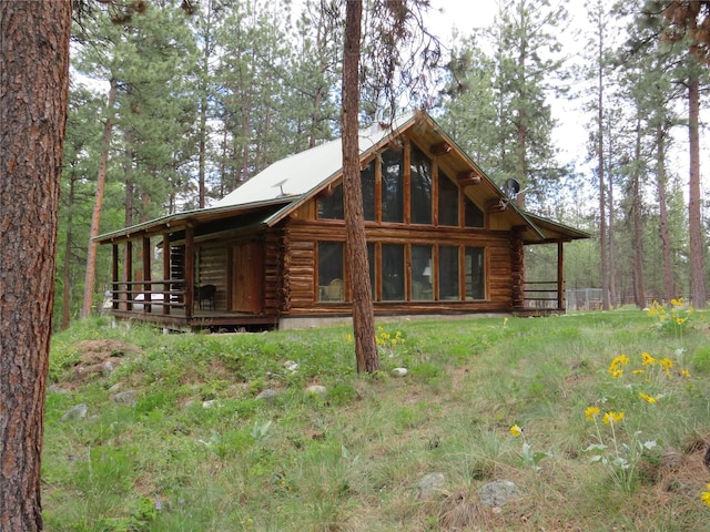 807 Pheasant Run, Hamilton, MT 59840 - rear view of property featuring log siding and a deck