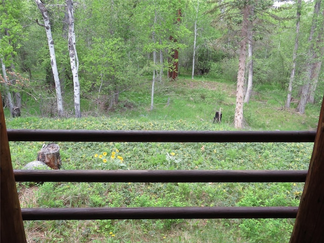 807 Pheasant Run, Hamilton, MT 59840 - view of yard featuring a balcony and a forest view