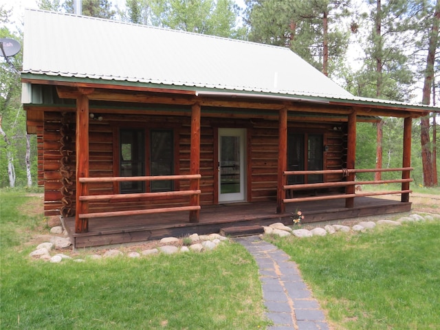 807 Pheasant Run, Hamilton, MT 59840 - view of front facade featuring log siding and metal roof