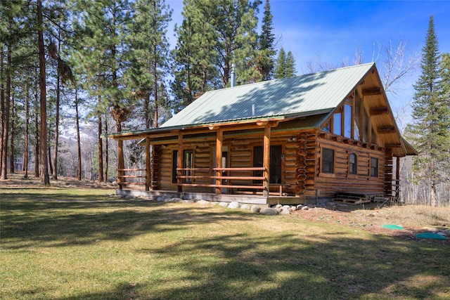 807 Pheasant Run, Hamilton, MT 59840 - log home with log exterior, a front yard, a porch, and metal roof