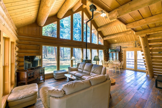 807 Pheasant Run, Hamilton, MT 59840 - living area with wood ceiling with exposed beams, dark wood-style floors, rustic walls, and high vaulted ceiling