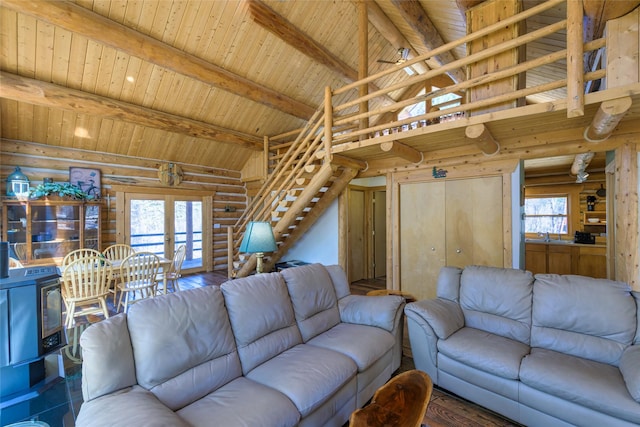 807 Pheasant Run, Hamilton, MT 59840 - living area featuring log walls, plenty of natural light, wood ceiling, and stairway