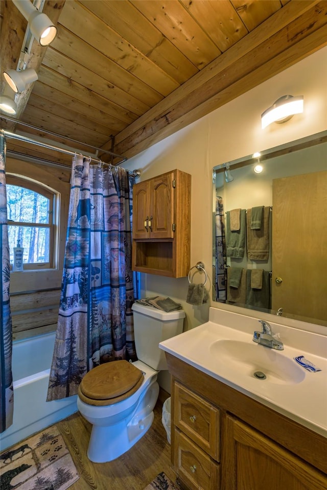 807 Pheasant Run, Hamilton, MT 59840 - full bath with toilet, wooden ceiling, vanity, and shower / tub combo with curtain