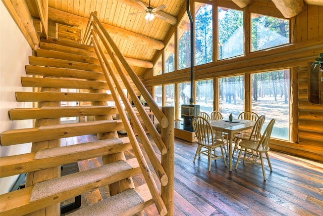 807 Pheasant Run, Hamilton, MT 59840 - dining room featuring wooden ceiling with exposed beams, rustic walls, stairway, hardwood / wood-style floors, and a ceiling fan