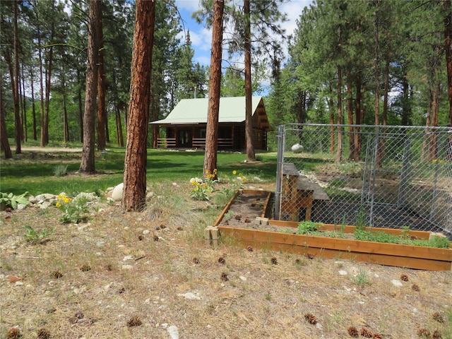 807 Pheasant Run, Hamilton, MT 59840 - view of yard with an outbuilding and a vegetable garden