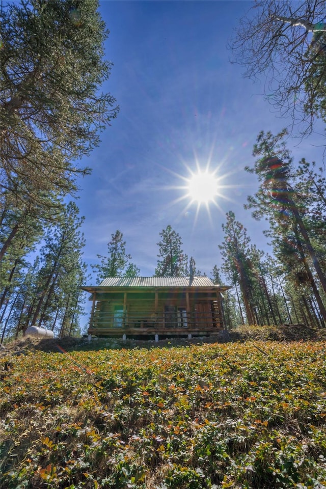 807 Pheasant Run, Hamilton, MT 59840 - back of house featuring log exterior and metal roof