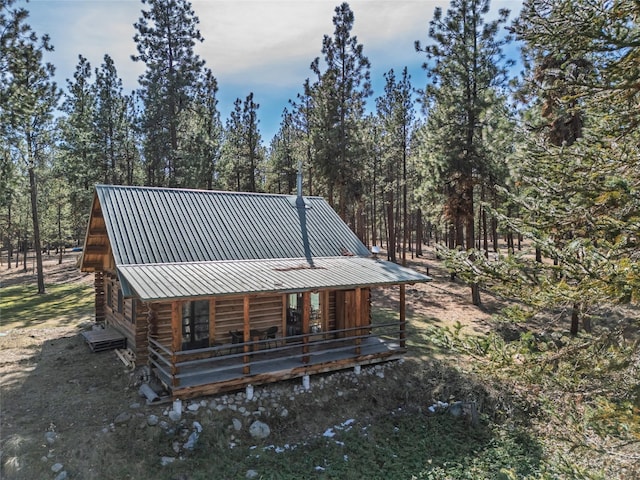 807 Pheasant Run, Hamilton, MT 59840 - rear view of property featuring log exterior and metal roof