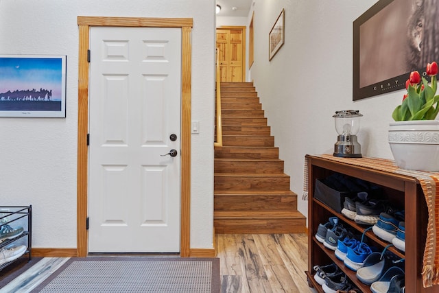 161 Oakmont Loop, Columbia Falls, MT 59912 - entryway with wood finished floors, stairway, and baseboards