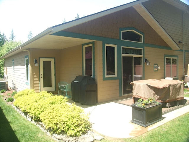 161 Oakmont Loop, Columbia Falls, MT 59912 - back of house featuring a patio
