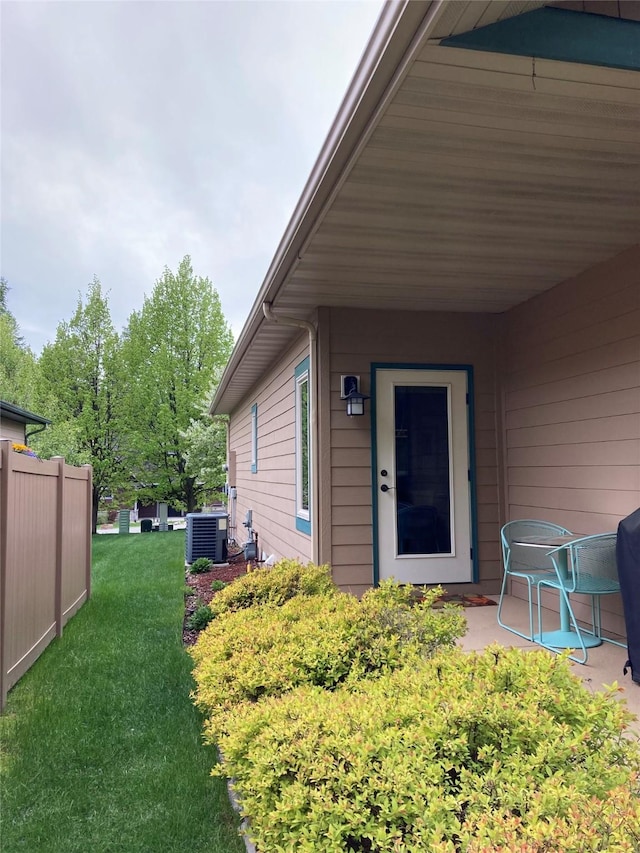 161 Oakmont Loop, Columbia Falls, MT 59912 - entrance to property with cooling unit and a patio