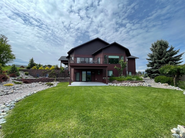 113 Mission Bay Dr, Polson, MT 59860 - back of property featuring a patio area and a yard